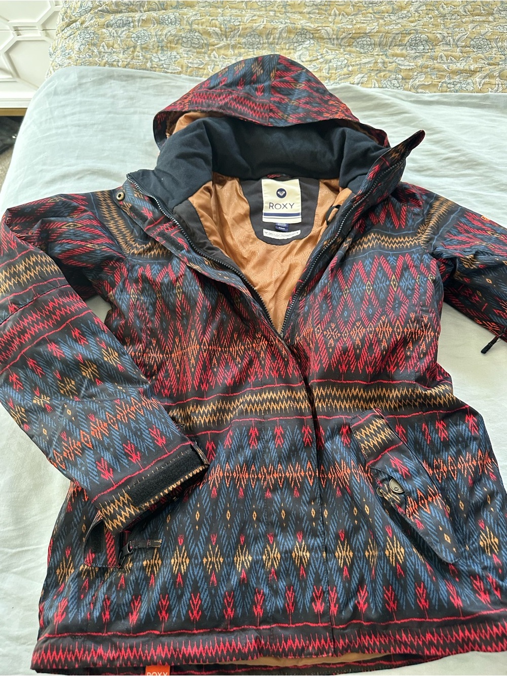 Roxy Women's Hooded Ski Jacket in Black with Red & Gold Pattern